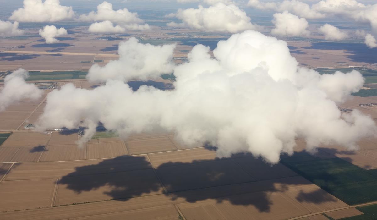 Farmland partly obscured by cloud cover seen from above